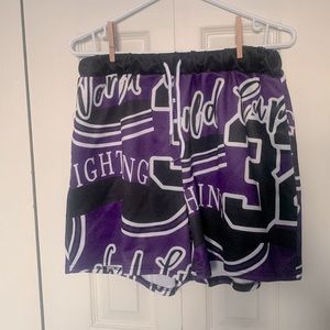 Shein. Size Large. Purple athletic shorts with graphic design.